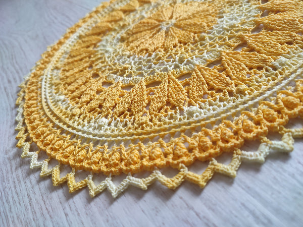 Cute yellow crochet doily with hearts