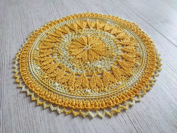 Cute yellow crochet doily with hearts