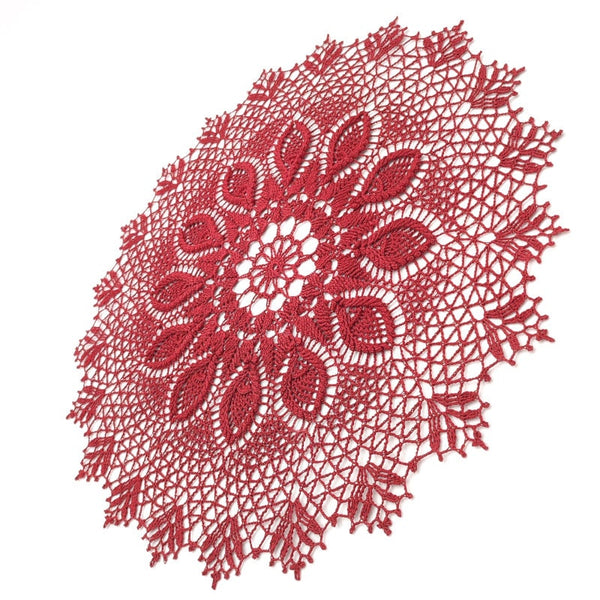 Deep red round crochet doily with 3D elements