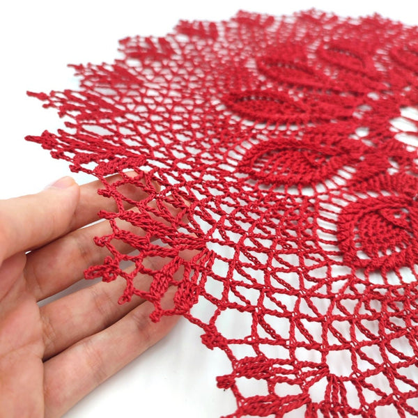 Deep red round crochet doily with 3D elements