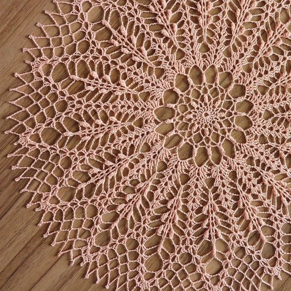 Peach colour round lace doily for elegant table or breakfast tray decoration