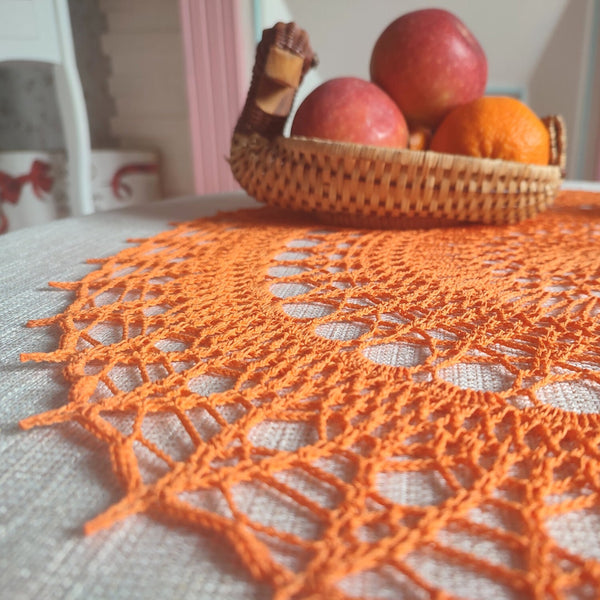 Bright orange large and cheerful lace crochet doily