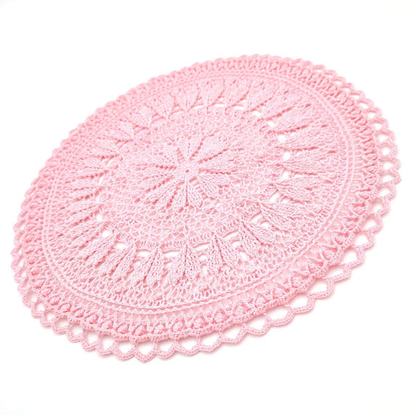 Pink round crochet doily with hearts for romantic coffee table decor