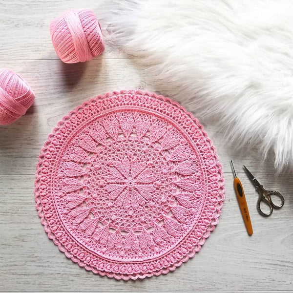 Pink round crochet doily with hearts for romantic coffee table decor