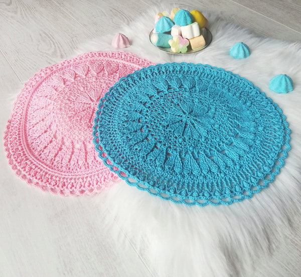 Romantic crochet set of two round placemats with hearts in blue and pink colour