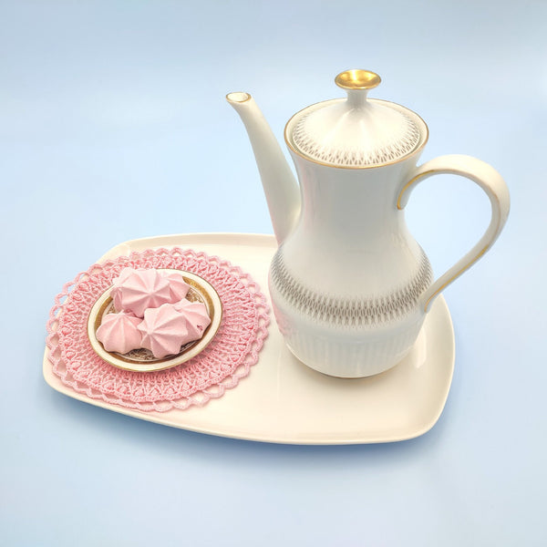 Valentine's day table decor set of a pink crochet placemat and a coaster with hearts