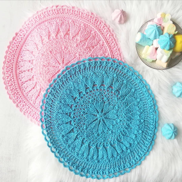 Romantic crochet set of two round placemats with hearts in blue and pink colour