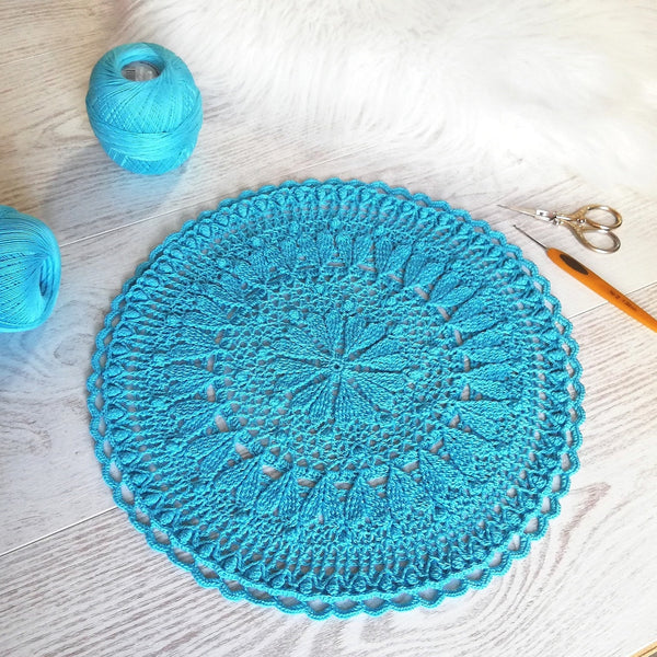 Romantic crochet set of two round placemats with hearts in blue and pink colour