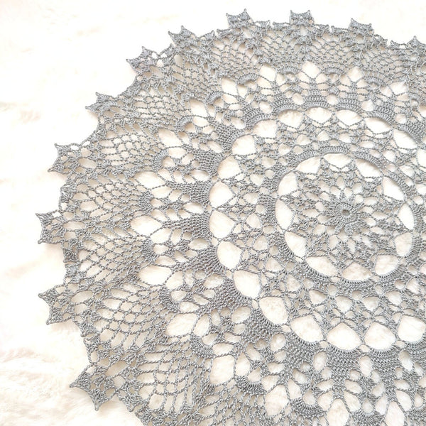 Delicate silver grey lace doily