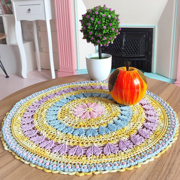 Large colourful yellow doily with pink blue and purple hearts for Easter table decoration