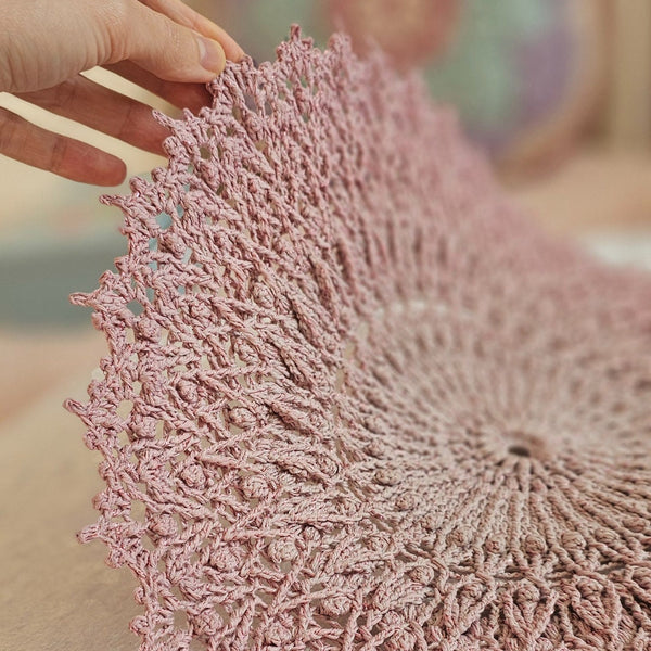 Pink crochet textured doily with glitter