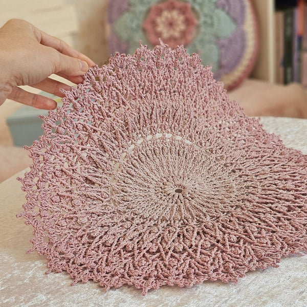 Pink crochet textured doily with glitter