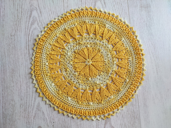 Cute yellow crochet doily with hearts