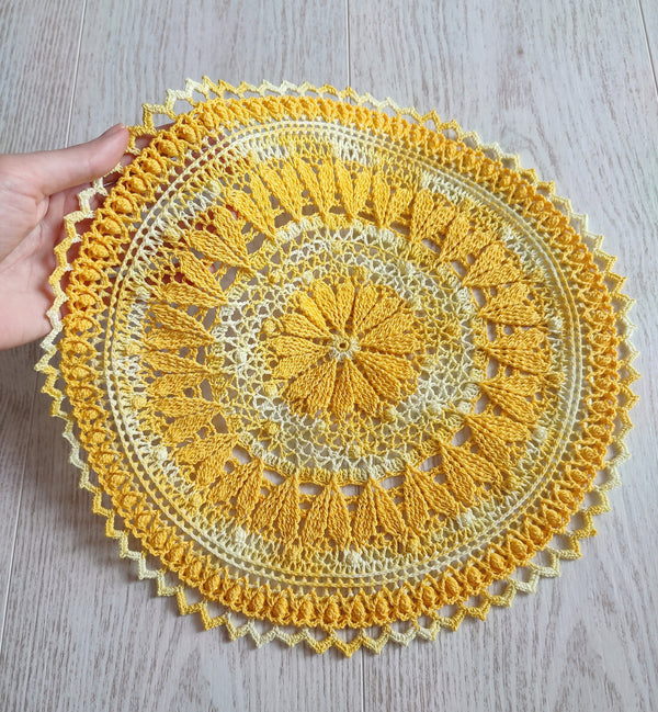 Cute yellow crochet doily with hearts