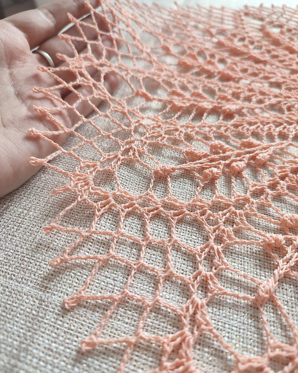 Peach colour round lace doily for elegant table or breakfast tray decoration