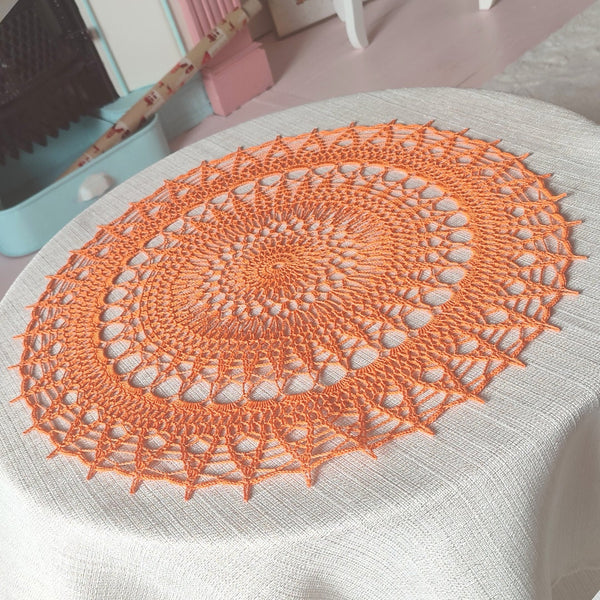 Bright orange large and cheerful lace crochet doily