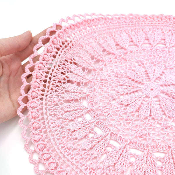 Pink round crochet doily with hearts for romantic coffee table decor