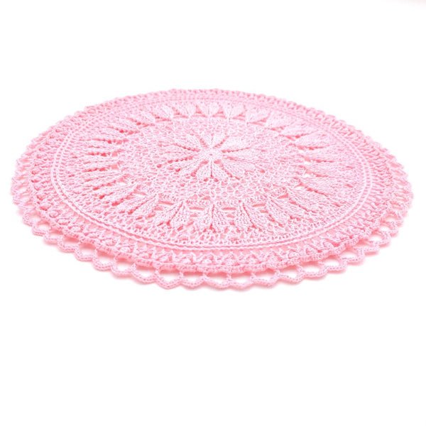 Pink round crochet doily with hearts for romantic coffee table decor