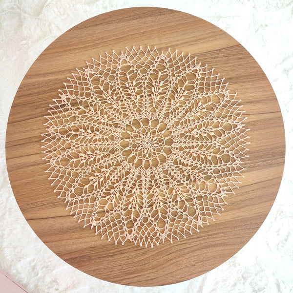 Peach colour round lace doily for elegant table or breakfast tray decoration