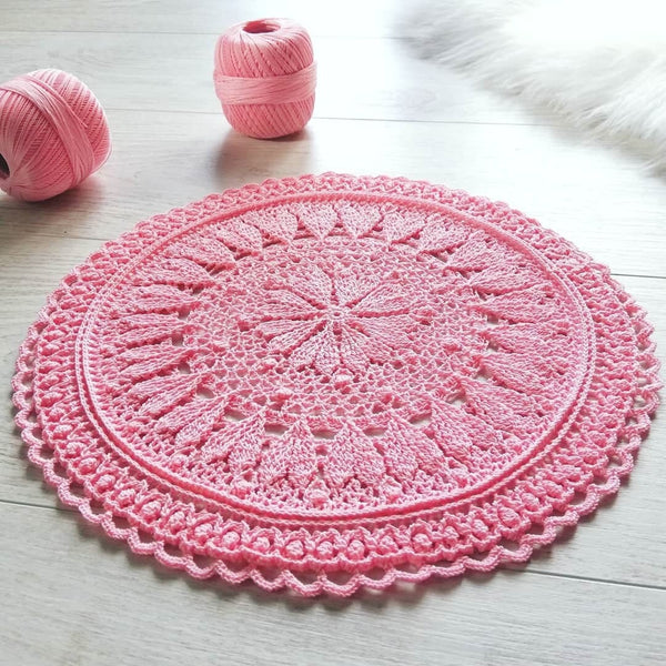 Pink round crochet doily with hearts for romantic coffee table decor