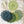 Set of seven round crochet coasters different shade of green each