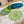 Set of seven round crochet coasters different shade of green each