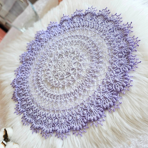 Light purple gradient textured doily 37 cm diameter.